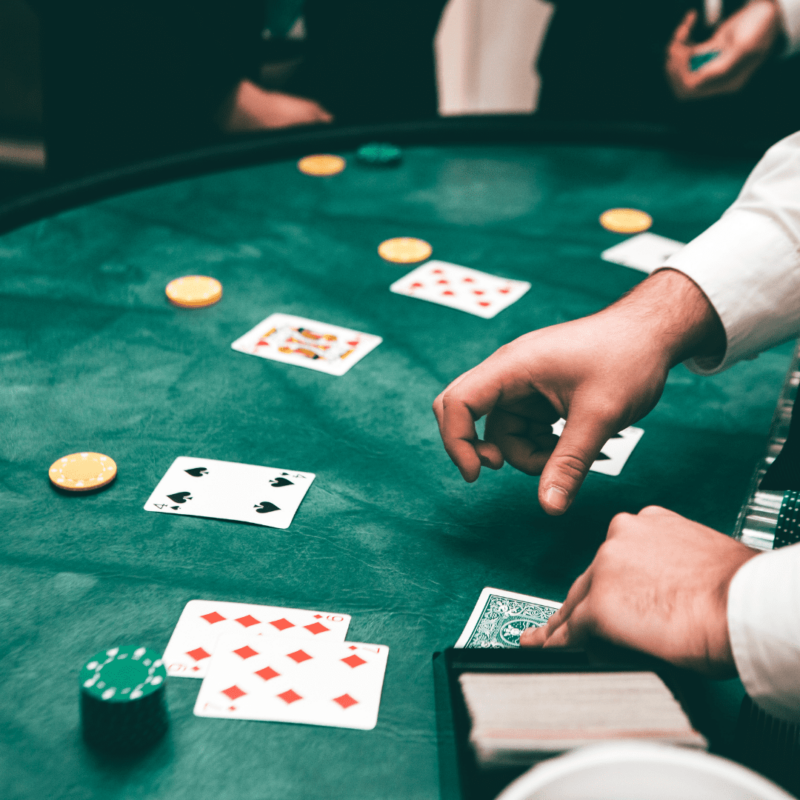 A man dealing cards for a game of poker