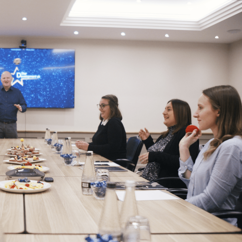 People doing team building around a table