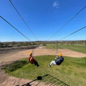 Two people on the zipline on Carden Parks Pusuits