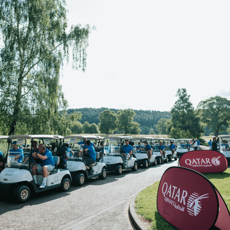 Golf carts lined up behind each other